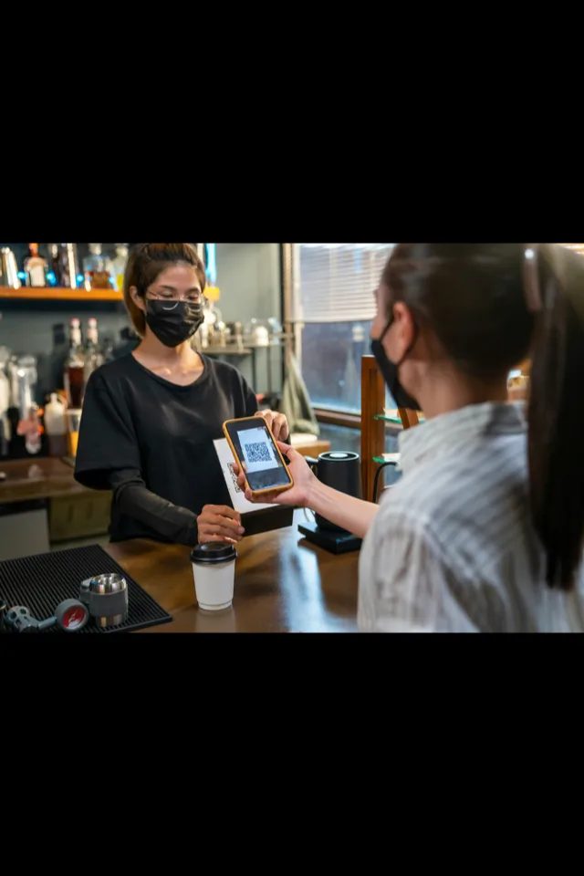Paying by scanning a QR code on a smartphone