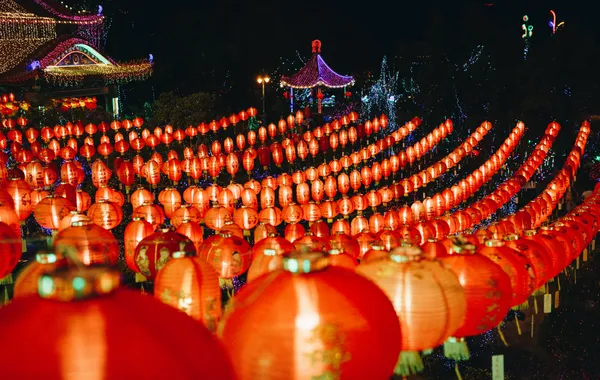 Rows of red Chinese lanterns lit at night