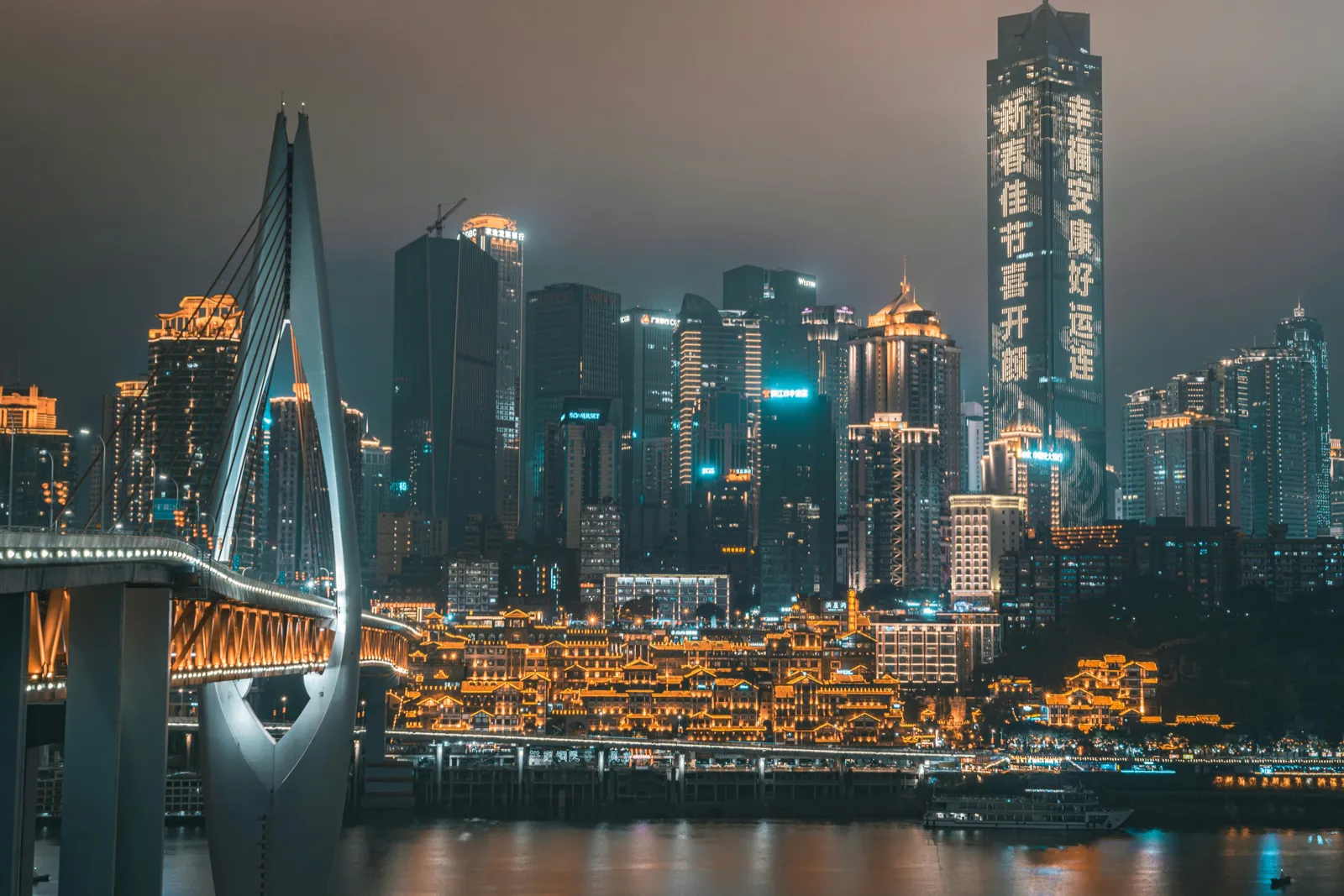 Chongqing’s stacked skyline of skyscrapers on the hillside at night