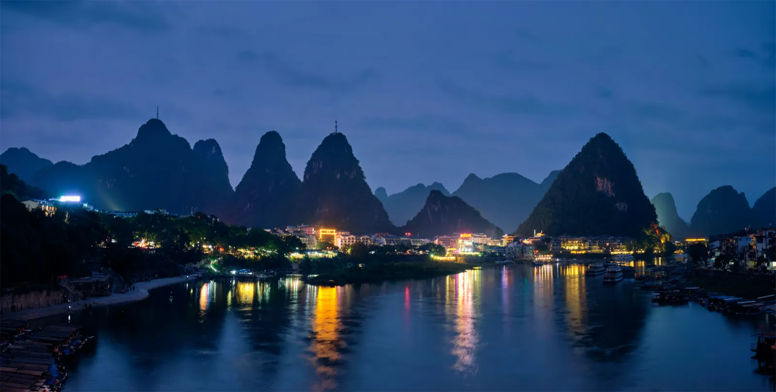 Towering karst peaks reflected in calm water near Guilin